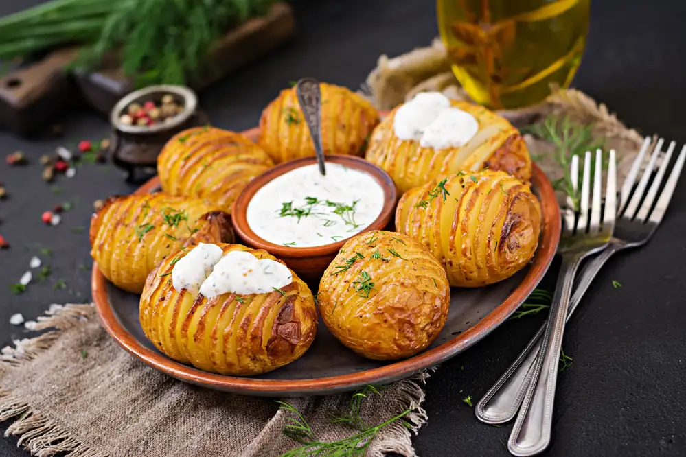 Baked potato with herbs sauce vegan food healthy meal