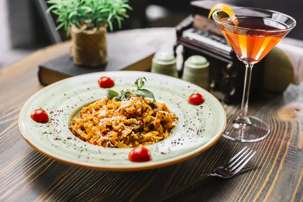 Fettuccine pasta chicken mushroom parmesan tomato mint sumakh cocktail side view