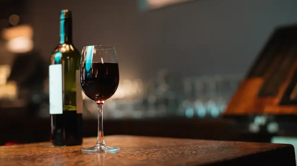 Glass red wine bottle bar counter